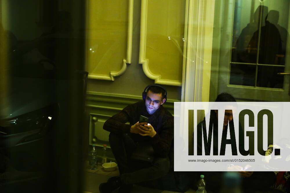 People Arrive In Poland After Fleeing Ukraine Passengers are checking their mobile phones inside a building of the railway station after arriving on a train from Kiev in Ukraine to Przemysl, Poland on February 24, 2022. Russian invasion on Ukraine can cause a mass exodus of refugees to Poland. Przemysl Poland