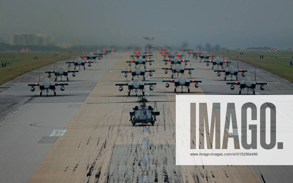 KW09 A formation of F-15C D Eagles assigned to the 44th and 67th Fighter Squadrons, and an HH-60 Pavehawk assigned to the 33rd Rescue Squadron taxi during a routine wing readiness exercise at Kadena Air Base, Japan, March 2, 2022. Similar training is routinely conducted at U.S. Air Force bases across Japan and around the globe to ensure U.S. Airmen?s readiness to respond to a range of potential contingencies. Where: Kadena Air base, Okinawa, Japan When: 02 Mar 2022 Credit: U.S. Air Force Cover Images **. MATERIALS ONLY TO BE USED IN CONJUNCTION WITH EDITORIAL STORY. THE USE OF THESE MATERIALS FOR ADVERTISING, MARKETING OR ANY OTHER COMMERCIAL PURPOSE IS STRICTLY PROHIBITED. MATERIAL COPYRIGHT REMAINS WITH U.S AIR FORCE.**