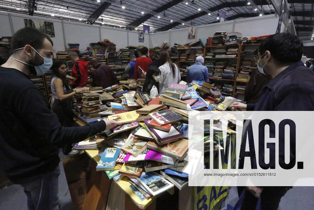 KW09 (220306) -- BEIRUT, March 6, 2022 -- People select books at the Beirut International and Arab Book Fair in Beirut, Lebanon, on March 6, 2022. ) TO GO WITH Feature: Lebanese book lovers, publishers keep unabated enthusiasm despite economic crisis LEBANON-BEIRUT-INTERNATIONAL AND ARAB BOOK FAIR BilalxJawich