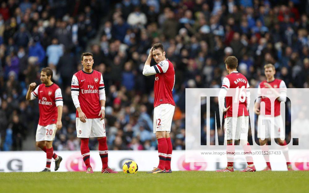 Arsenal s Mesut Ozil and Olivier Giroud look on dejected after going 5-2 down Manchester City vs Arsenal - Premier League - Etihad Stadium - Manchester - England - 14 12 2013 - Pic David Klein Sportimage .