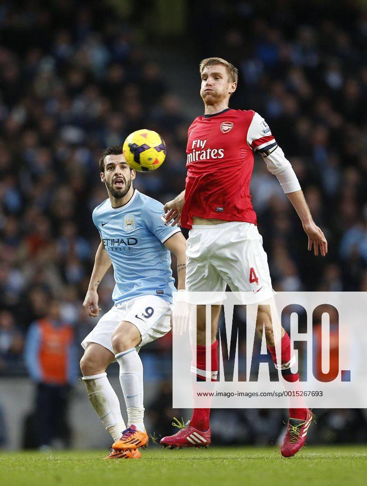 Manchester City s Alvaro Negredo tussles with Arsenal s Per Mertesacker Manchester City vs Arsenal - Premier League - Etihad Stadium - Manchester - England - 14 12 2013 - .