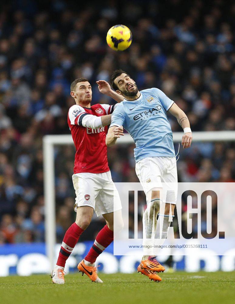 Manchester City s Alvaro Negredo tussles with Arsenal s Thomas Vermaelen Manchester City vs Arsenal - Premier League - Etihad Stadium - Manchester - England - 14 12 2013 - .
