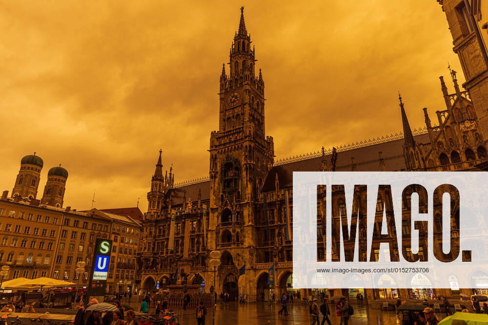 A rare meteorological phenomenon causing an orange sky due to sahara sand dust in the sky on March 15, 2022 in Munich, Germany Sahara sand dust causing an orange sky over Marienplatz in Munich Munich Germany