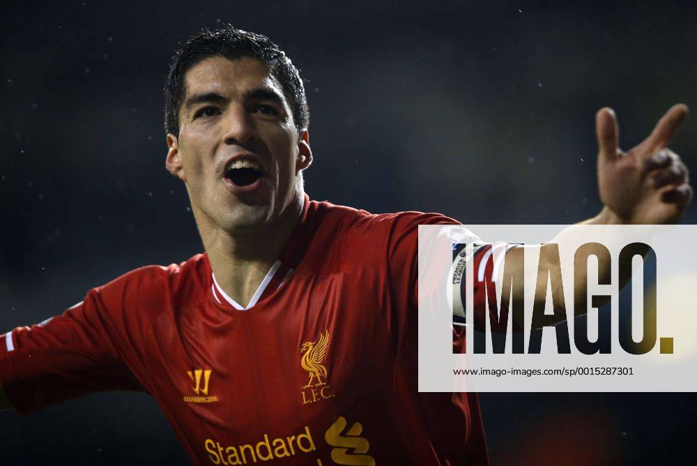 Luis Suarez of Liverpool celebrates scoring their fourth goal during the Barclays Premier League match between Tottenham Hotspur and Liverpool at White Hart Lane in London, Britain on Dec. 15, 2013. Liverpool won 5-0. (Xinhua Wang Lili) FOR . NOT FOR SALE FOR MARKETING OR ADVERTISING CAMPAIGNS. NO USE WITH UNAUTHORIZED AUDIO, VIDEO, DATA, FIXTURE LISTS, CLUB LEAGUE LOGOS OR LIVE SERVICES. ONLINE IN-MATCH USE LIMITED TO 45 IMAGES, NO VIDEO EMULATION. NO USE IN BETTING, GAMES OR SINGLE CLUB LEAGUE PLAYER PUBLICATIONS. (SP)BRITAIN-LONDON-SOCCER-PREMIER LEAGUE-TOTTENHAM HOTSPUR VS LIVERPOOL