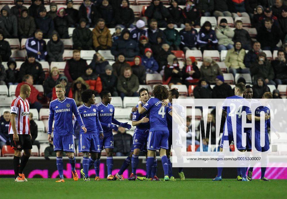 Frank Lampard of Chelsea celebrates scoring the opening goal of the game with his team-mates .