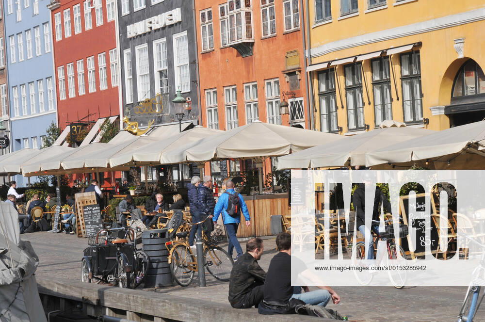 Copenhagen Denmark.22 March 2022 .Torits enjoy sun shine weather boat cruising enjoy food and drinks at cafe adn bars and restaurant on Nyhavn canal in danish capital. (Photo..Francis Dean Dean Pictures)