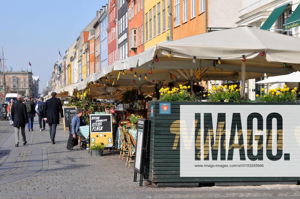 Copenhagen Denmark.22 March 2022 .Torits enjoy sun shine weather boat cruising enjoy food and drinks at cafe adn bars and restaurant on Nyhavn canal in danish capital. (Photo..Francis Dean Dean Pictures)