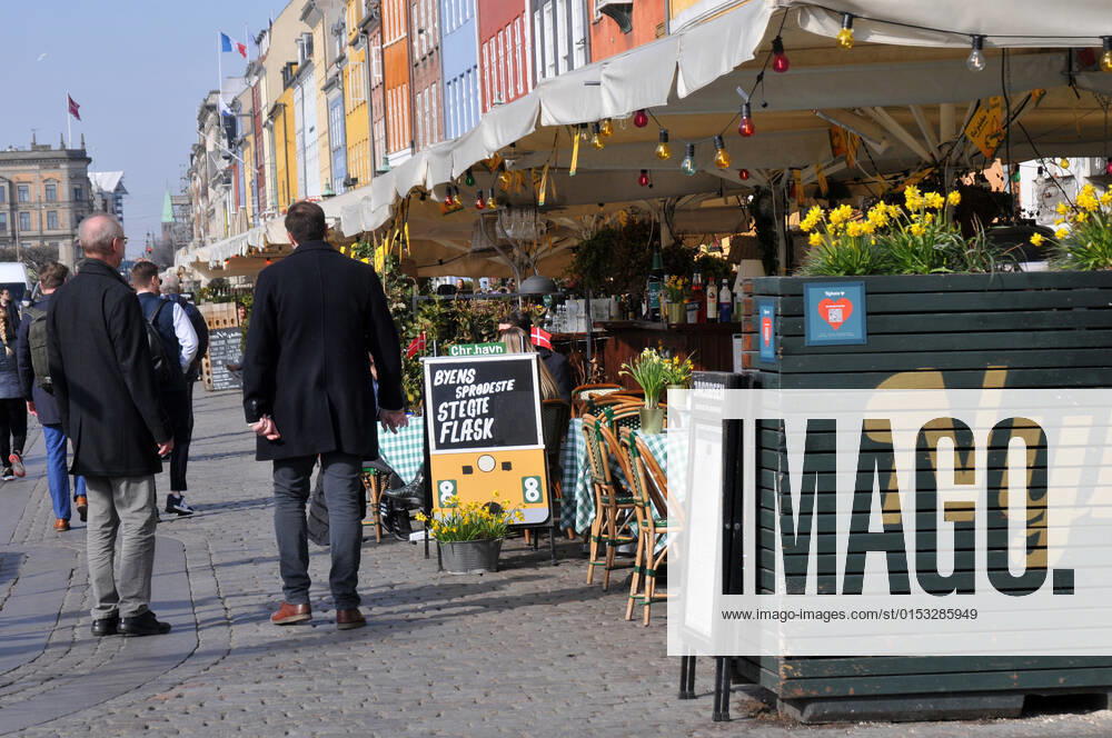 Copenhagen Denmark.22 March 2022 .Torits enjoy sun shine weather boat cruising enjoy food and drinks at cafe adn bars and restaurant on Nyhavn canal in danish capital. (Photo..Francis Dean Dean Pictures)