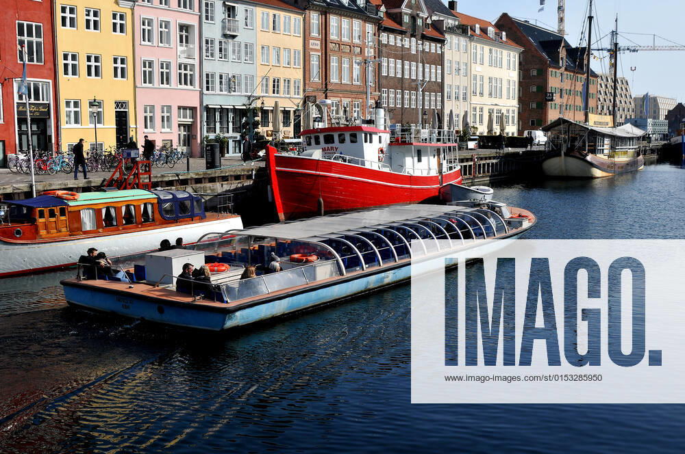 Copenhagen Denmark.22 March 2022 .Torits enjoy sun shine weather boat cruising enjoy food and drinks at cafe adn bars and restaurant on Nyhavn canal in danish capital. (Photo..Francis Dean Dean Pictures)