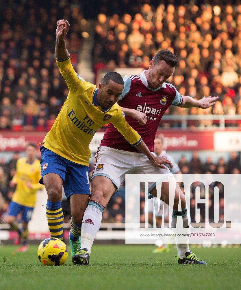 Arsenal s Theo Walcott and West Ham s Kevin Nolan - West Ham vs. Arsenal - Barclays Premier League - Boleyn Ground - London - 26 12 2013 Pic Philip Oldham Sportimage .