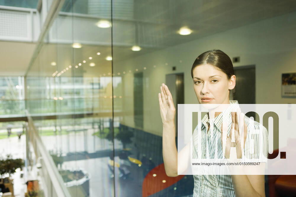 Portrait of young attractive businesswoman standing behind glass window in office, model released, , property released, , 33090320.jpg, Day,Standing,30-35 Years,Business,Office,Indoors,Portrait,One Person Only,Half-Length,people,Closed Eyes,Business And Commerce,Serious,Office Interior,Occupations And Work,Blouse,Business Woman,Shirt,Office Worker,Pensive,Caucasian,Wall,Glass,Overworked,young woman,Office Building,Loneliness,behind,Sadness,Modern Life,partition,Isolation,Trapped,Middle Parting,Glass Material