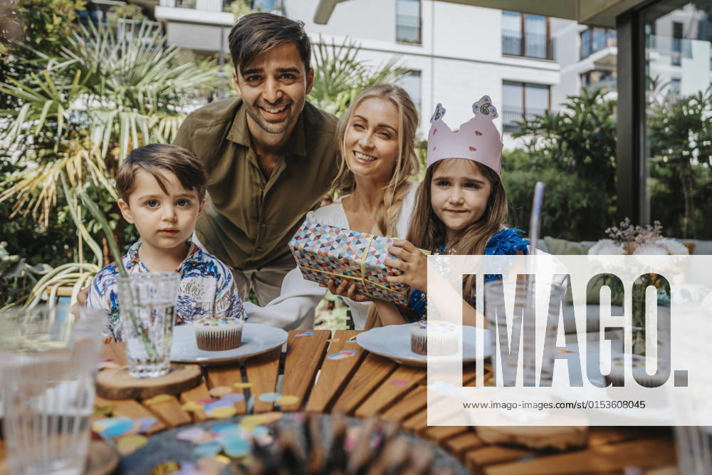Smiling parents with children on birthday party model released property released, MFF08573
