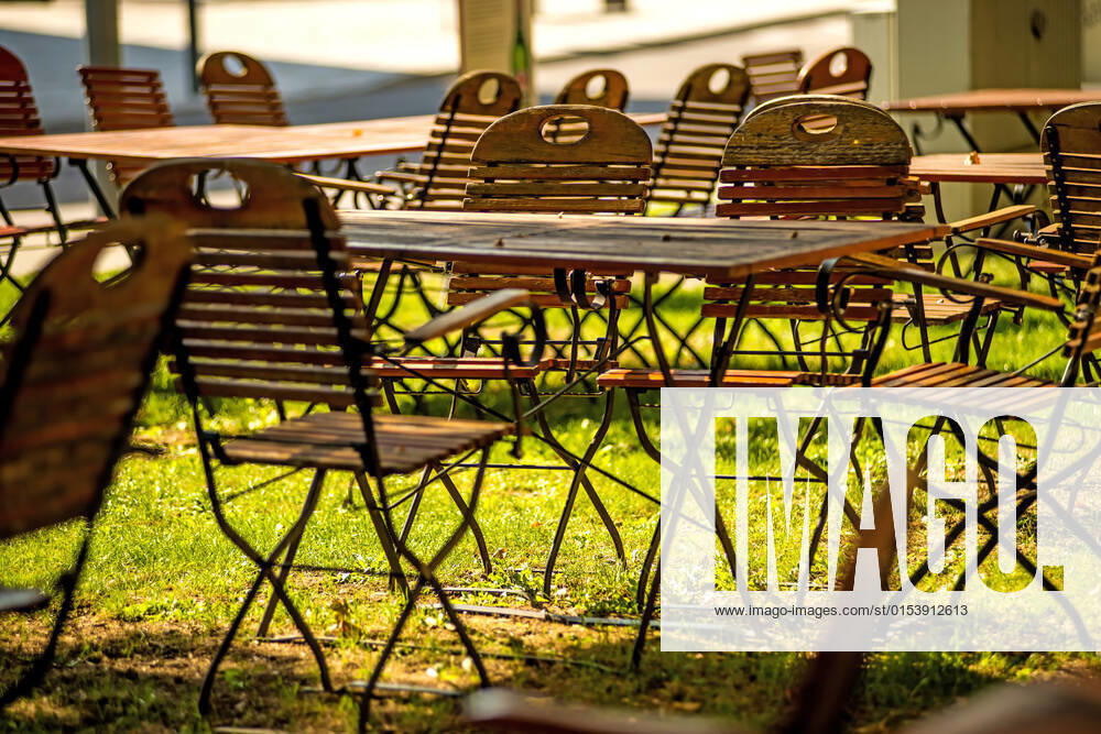 Empty chairs and desks of a garden restaurant, model released, , property released, , 33770766.jpg, chairs, empty, desks, beer garden, garden restaurant, outdoor, wooden sunny, no people, lonesome, lonly, gastronomy, grass