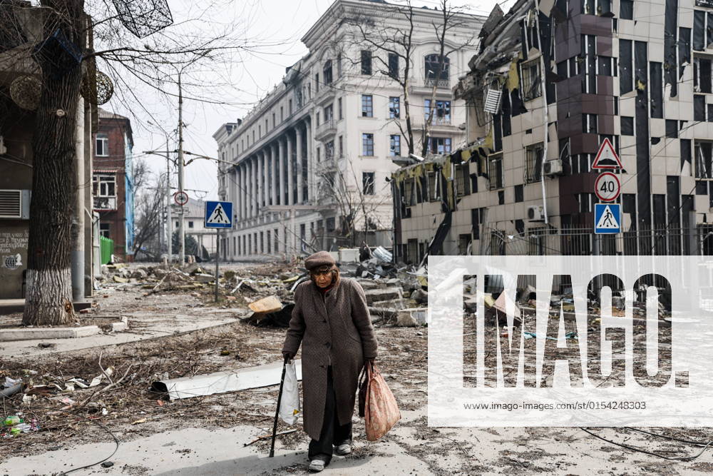 A local resident walks in a street in the city of Mariupol. The Russian Armed Forces are carrying out a special military operation in Ukraine. Sergei Bobylev TASS TS12A9C5