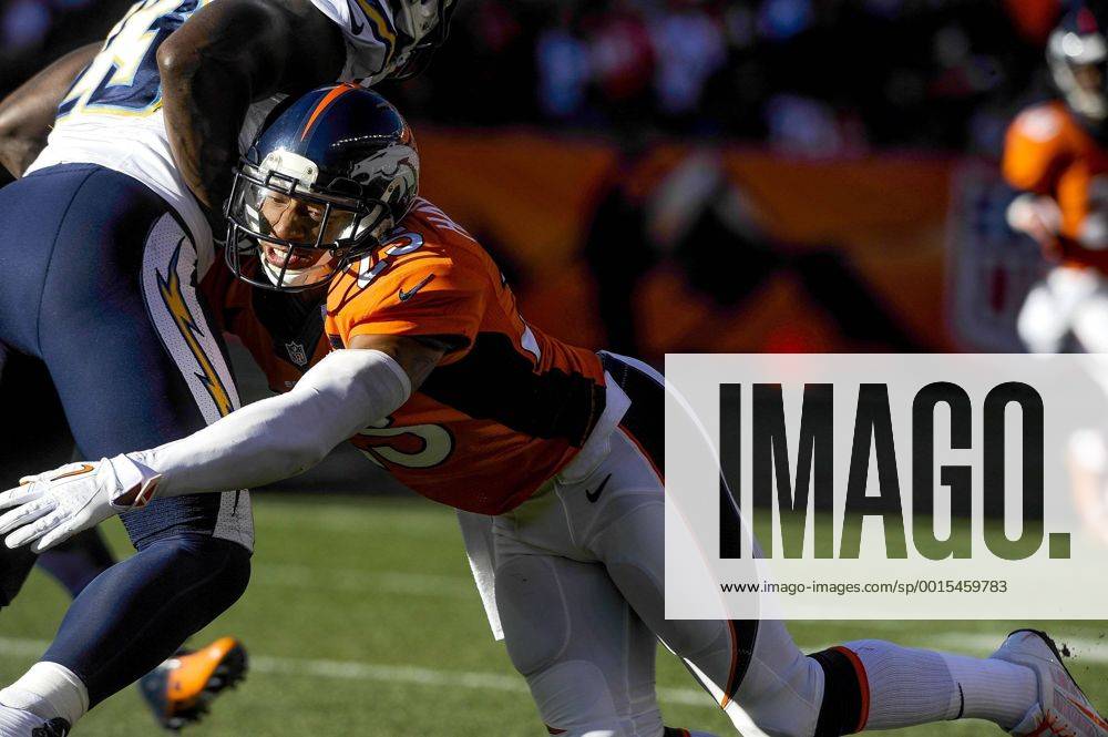 Jan. 12, 2014 - Denver, CO, USA - Denver Broncos cornerback Chris Harris Jr. dives in to tackle San Diego Chargers running back Ronnie Brown during the AFC divisional playoffs in Denver on Sunday, Jan. 12, 2014. BRONCOS CHARGERS - ZUMAm67