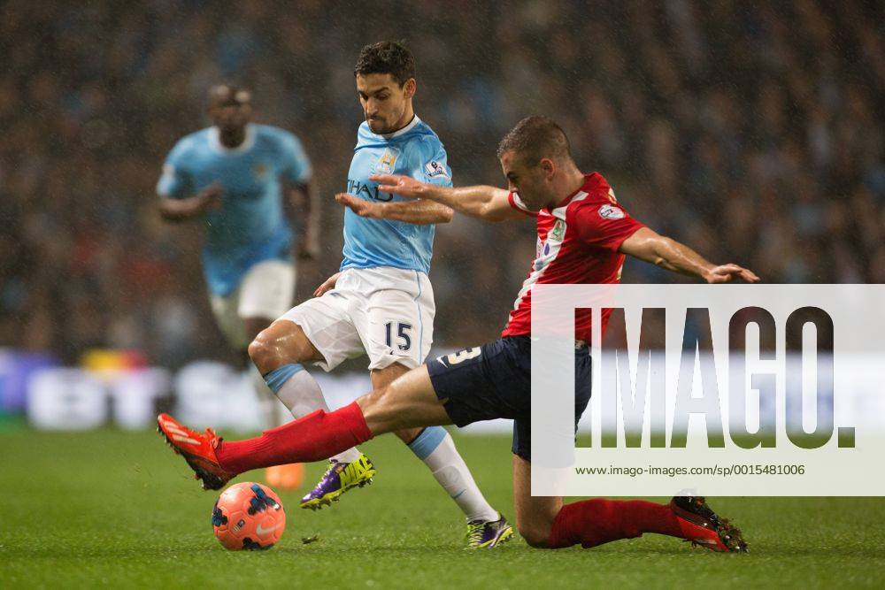 Tommy Spurr of Blackburn Rovers challenges Jesus Navas of Manchester City - Manchester City vs. Blackburn Rovers - FA Cup Third Round Replay - Etihad Stadium - Manchester - 15 01 2014 Pic Philip Oldham Sportimage .