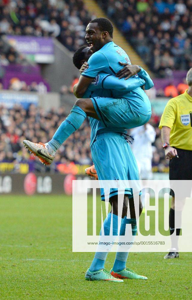 Emmanuel Adebayor of Tottenham celebrates the third goal with Danny Rose of Tottenham - Barclays Premier League - Swansea City vs Tottenham Hotspur - Liberty Stadium - Swansea - Wales - 19th January 2014 - .