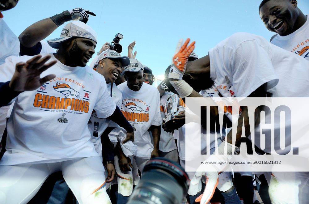 Jan. 18, 2014 - Denver, CO, USA - Broncos players celebrate with the AFC Championship Trophy at Sports Authority Field at Mile High in Denver on Sunday, Jan. 19, 2014. The Denver Broncos defeated the New England Patriots, 26-16. BRONCOS PATRIOTS - ZUMAm67