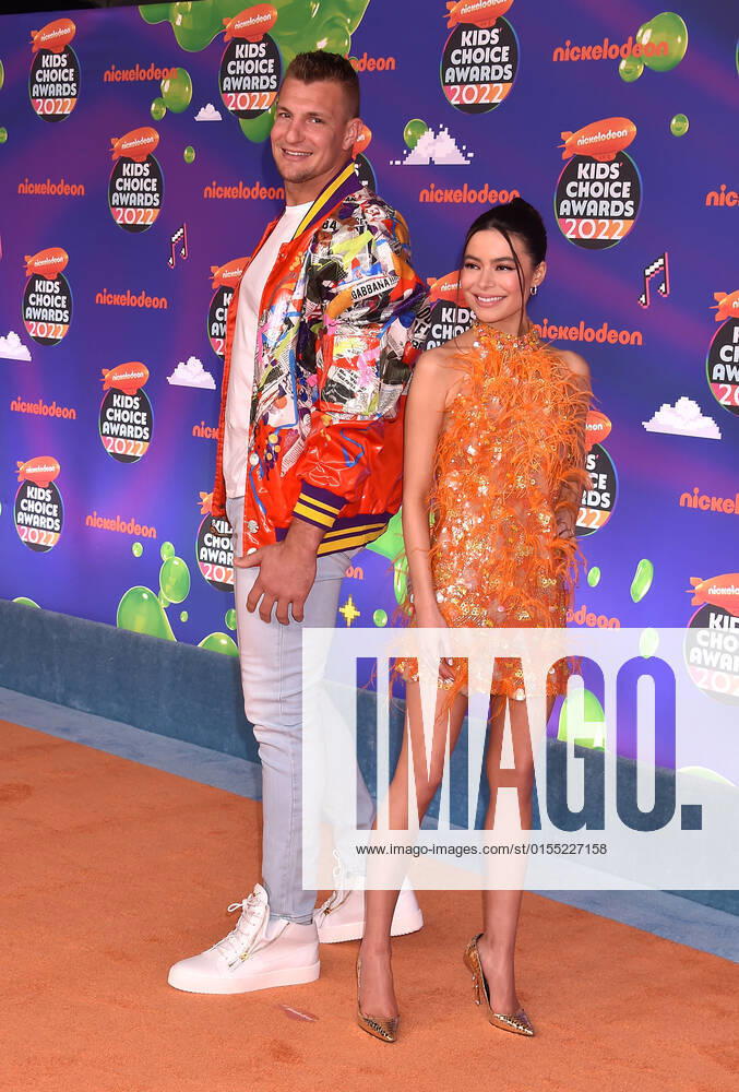 SANTA MONICA, CA - APRIL 9: Rob Gronkowski and Miranda Cosgrove at the 2022 Nickelodeon Kids Choice Awards at the Barker Hangar in Santa Monica, California on April 9, 2022.