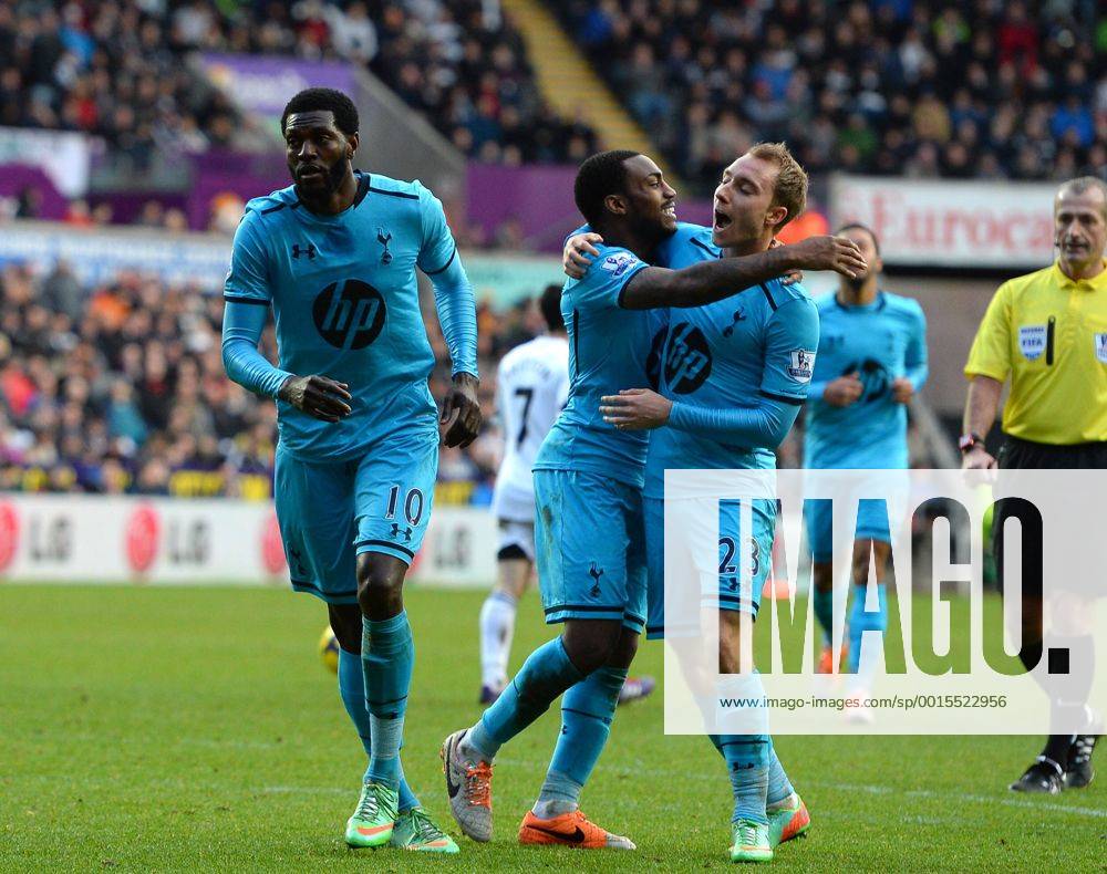 Emmanuel Adebayor of Tottenham celebrates his goal with Danny Rose and Christian Eriksen of Tottenham - Barclays Premier League - Swansea City vs Tottenham - Liberty Stadium - Swansea - Wales - 19th January 2014 - Picture Simon Bellis Sportimage .