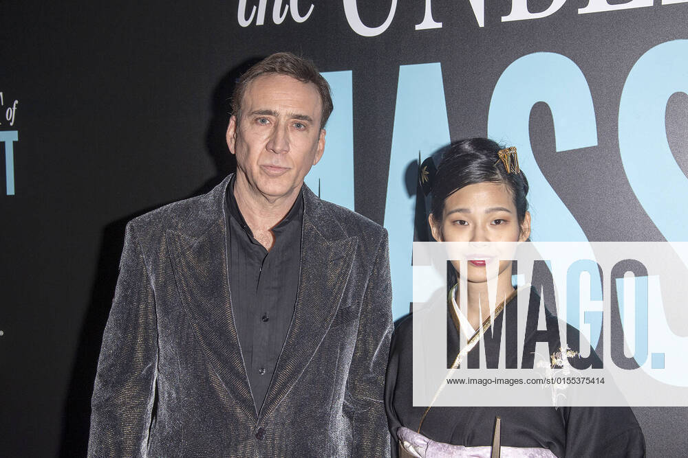 NICOLAS CAGE and his wife RIKO SHIBATA attend â€oeThe Unbearable Weight of Massive Talent†New York Premiere,.The Regal Essex Crossing, NYC.April 10, 2022. New York USA - ZUMAms4_ 20220410_zaf_ms4_012