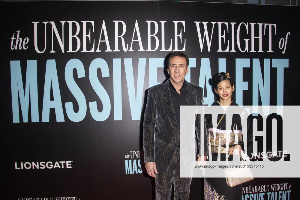 NICOLAS CAGE and his wife RIKO SHIBATA attend Ã¢â‚¬oeThe Unbearable Weight of Massive TalentÃ¢â‚¬Â New York Premiere,.The Regal Essex Crossing, NYC.April 10, 2022. New York USA - ZUMAms4_ 20220410_zaf_ms4_013