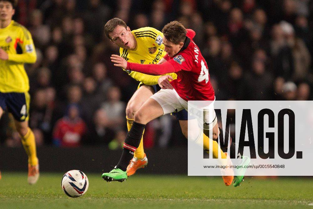 Adnan Januzaj of Manchester United (ManU) loses his boot in a battle with Craig Gardner of Sunderland FC - Manchester United (ManU) vs. Sunderland FC - Capital One Cup Semi Final Second Leg - Old Trafford - Manchester - 22 01 2014 Pic Philip Oldham Sportimage .
