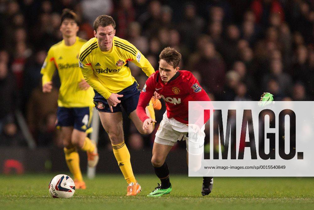 Adnan Januzaj of Manchester United (ManU) loses his boot in a battle with Craig Gardner of Sunderland FC - Manchester United (ManU) vs. Sunderland FC - Capital One Cup Semi Final Second Leg - Old Trafford - Manchester - 22 01 2014 Pic Philip Oldham Sportimage .