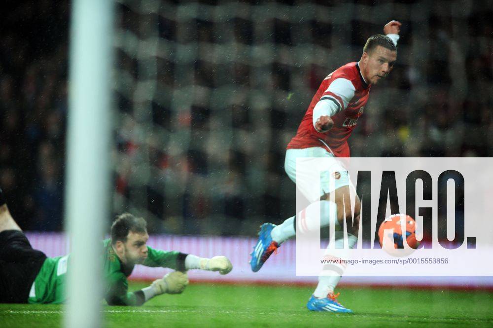 Football - 2013 2014 FA Cup - Fourth Round: Arsenal vs. Coventry City Arsenal s Lukas Podolski scores goal no 1 at The Emirates. COLORSPORT ANDREW COWIE