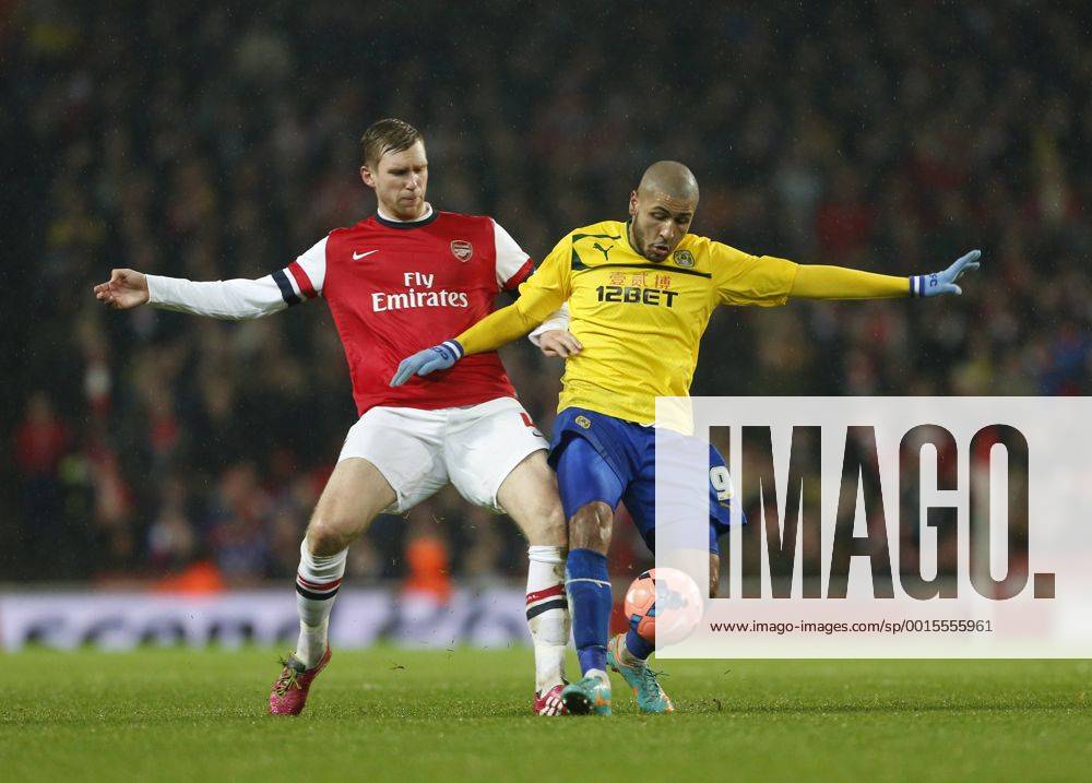 Arsenal s Per Mertesacker tussles with Coventry s Leon Clarke Arsenal vs Coventry City - FA Cup Fourth Round - Emirates Stadium - London - England - 24 01 2014 - Pic David Klein Sportimage .
