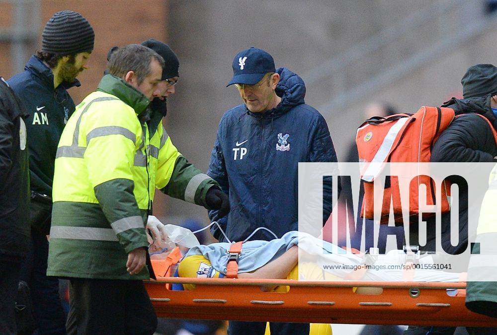 Tony Pullis manager of Crystal Palace checks on Jonathan Parr of Crystal Palace as he is stretchered off - FA Cup 4th round - Wigan Athletic vs Crystal Palace - DW Stadium - Wigan - England - 25th January 2014 - .