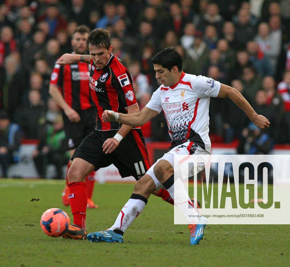 Football - 2013 2014 FA Cup - Fourth Round: AFC Bournemouth vs. Liverpool FC Luis Suarez of Liverpool flicks the ball round Bournemouth s Charlie Daniels at Dean Court The Goldsands Stadium Colorsport ShaunxBoggust