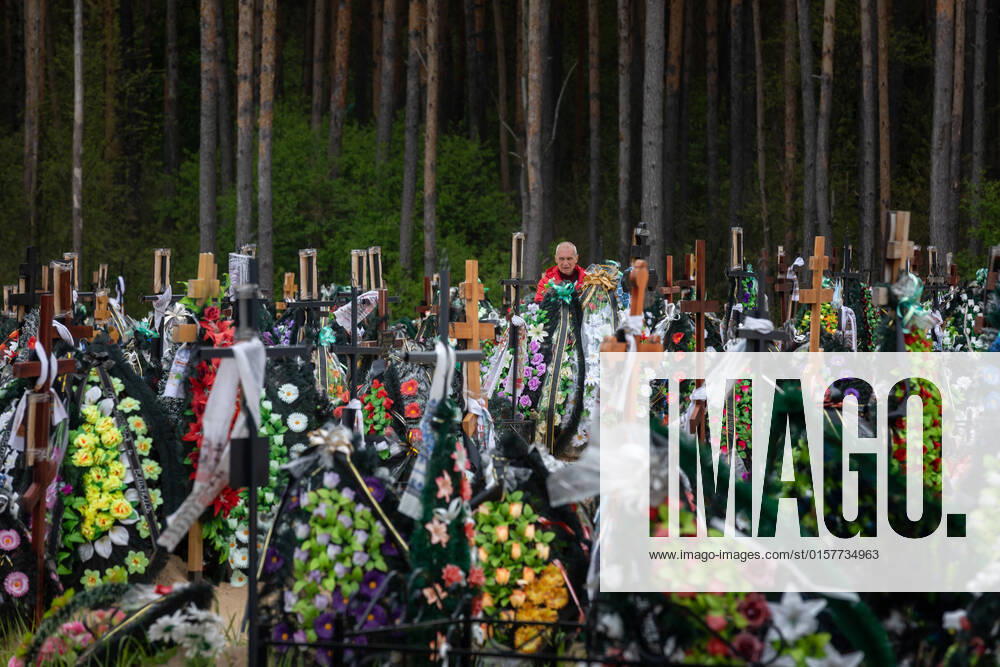 A large number of fresh graves in the cemetery in Irpin where local residents and members of territorial defense are buried who were killed as a result of Russian invasion of Ukraine. People commemorate their loved ones at the cemetery, Irpin, Kyiv region, Ukraine amid the Russian aggression on Ukraine. Irpin Ukraine - ZUMAs197 20220501_zaa_s197_313