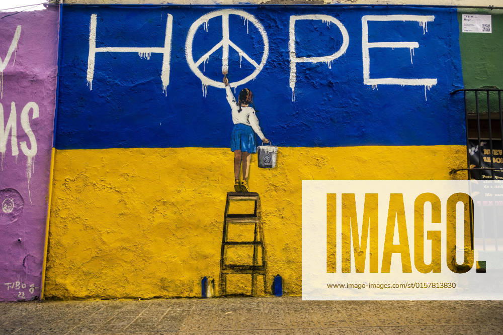 A mural graffiti by Italian urban artist TVBoy , Salvatore Benintende, titled Hope depicting a little girl in front of the Ukrainian colors writing the word HOPE in protest to the ongoing Russian attacks Barcelona Spain - ZUMAo105 20220502_zap_o105_018