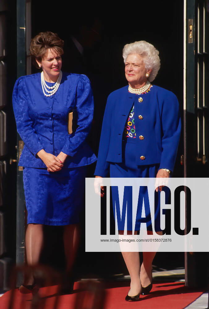 WASHINGTON DC - OCTOBER 18, 1991.Virginia Thomas wife of Judge Clarence Thomas and First Lady Barbara Bush in matching blue outfits walk out the South portico door onto the South Lawn of the White House to participate in the swearing in of Judge Thomas as Associate Justice of the United States Supreme Court Washington US - ZUMAr142 19911018_zap_r142_051