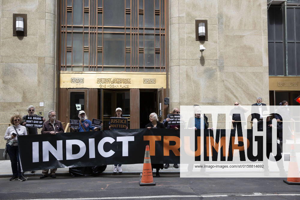 Members of activist organization Rise And Resist protested outside of Manhattan District Attorney Alvin BraggÃ¢â‚¬â ¢s office calling for indictments for the Jan 6 coup leaders. Protesters held a large banner that reads Ã¢â‚¬oeIndict TrumpÃ¢ New York USA - ZUMAr174 20220511_znp_r174_046