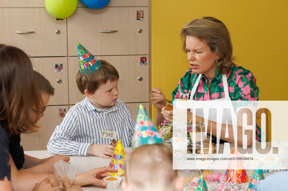 Queen Mathilde of Belgium decorates a cupcake with a boy (Tygo) during a royal visit to De Kindervriend, a multifunctional center for children with intellectual disabilities, in the context of the Week of Care, in Rollegem, Kortrijk, Friday 13 May 2022. The Week of Care (Week van de Zorg) is an initiative of Dag van de Zorg vzw. This year the focus is on prevention. This annual campaign puts the needs of and developments in the care and welfare sector in the spotlight. In Rollegem, the Queen will become acquainted with the specific framework for the children and will participate in a number of empathic moments. KURTxDESPLENTER 34947272