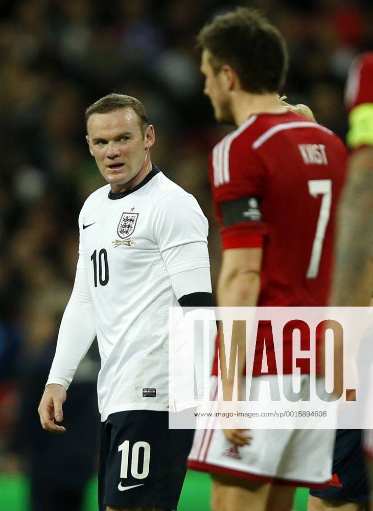(140306) -- LONDON, March 6, 2014 (Xinhua) -- Wayne Rooney(L) of England reacts after missing a goal during an international friendly soccer match between England and Denmark at Wembley Stadium in London, Britain on March 5, 2014. England won 1-0.(Xinhua Wang Lili) (SP)BRITAIN-LONDON-SOCCER-INTERNATIONAL FRIENDLY-ENG VS DEN