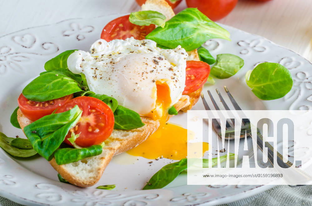 Fresh Healthy Breakfast - poached egg on baguette with salad, tomato and olive oil, very simple and delicious, place for your advertisment , 22993640.jpg, poached, egg, toast, breakfast, baguette, salad, food, meal, bread, healthy, fresh, homemade, sandwich, cooked, parsley, wooden, delicious, tomato, lunch, pepper, yolk, green, eggs, yellow, plate, tasty, vegetarian, white, natural, diet, ingredient, cuisine, appetizer, brunch, closeup, toasted, morning, eating, rucola, table, lettuce, benedict, bio, organic, rustic, wood, white wood, place for advertisment, tomato, olive oil,