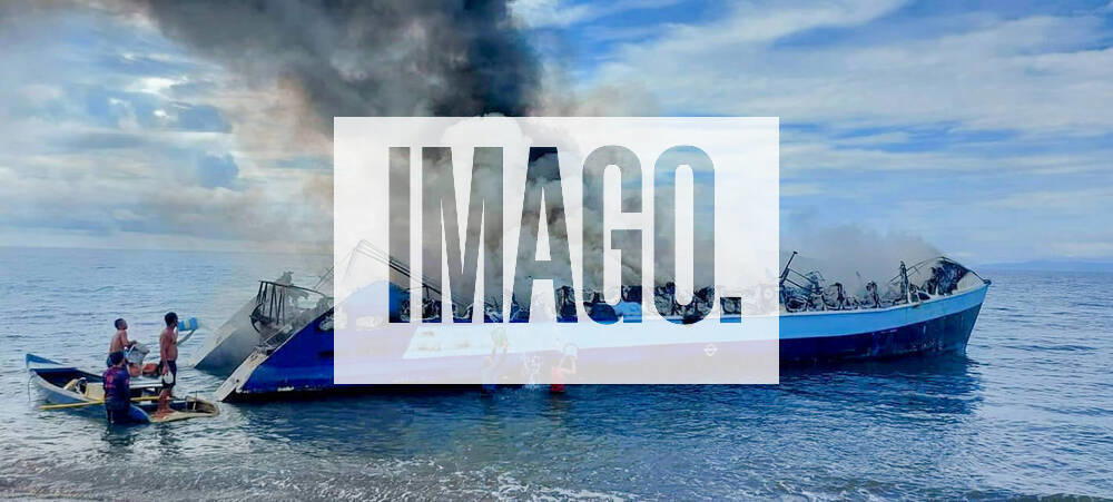 (220523) -- QUEZON PROVINCE, May 23, 2022 -- Smoke billows from a burning ferry in Quezon Province, the Philippines on May 23, 2022. A ferry with 124 passengers and 10 crew members on board caught fire on Monday while traveling to a town in Quezon province on the main Luzon island, leaving at least seven dead, a spokesperson for the Philippine Coast Guard () said. ( Handout via Xinhua) PHILIPPINES-QUEZON PROVINCE-FERRY FIRE PCG