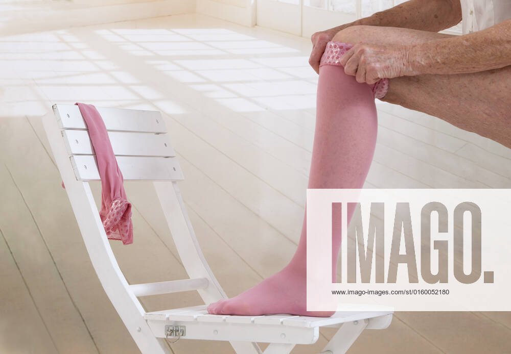 Woman putting thrombosis stockings on , 19650760.jpg, Anti, Bed, Bedroom, Pharmacist, Shelf, aching, adult, ankle, antithrombotic, arteries, background, bandage, beige, care, caucasian, clinic, compress, compression, compressive, difficulties, disease, doctor, dvt, edema, elastic, female, foot, hands, health, healthcare, heart, isolated, leg, lifestyle, limbs, lymph, lymphedema, medical, medicine, nodes, nursing, pharmacy, pressure, prosthesis, pull, retail, sick, stock, stocking, stockings, stool, store, studio, supplies, tedious, thrombosis, tighten, treatment, varicose, varicosis, veins, vertical, water, white, young,