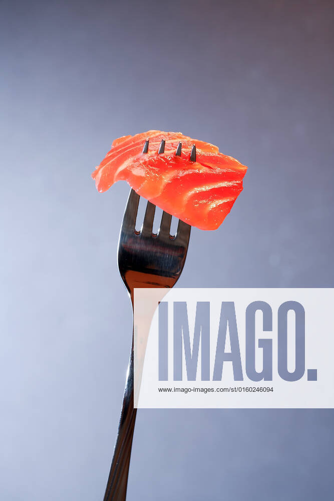 Closeup of steel fork with slice of salmon on dark background , 20446804.jpg, Salmon, Trout, Chinook, Fish, Snack, Appetizer, Gourmet, Meal, Food, Cooking, Restaurant, Portion, Slice, Eating, Seafood, Delicacy, Salted, Fork, Silverware,