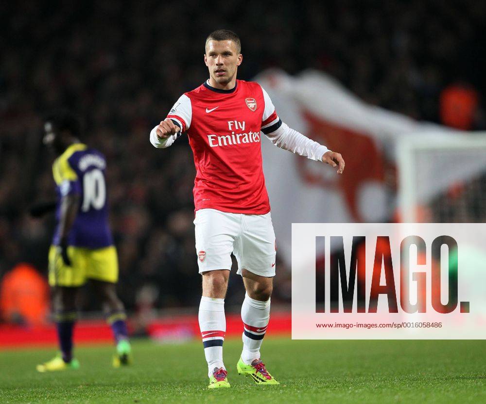 Arsenal s Lukas Podolski celebrates scoring his side opening goal Arsenal vs Swansea City - Premier League - Emirates Stadium- London - England - 25 03 2014 - Pic David Klein Sportimage .