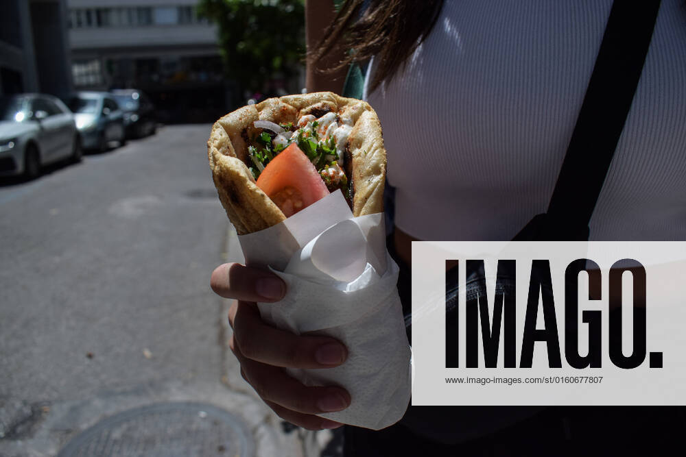 Greece: Popular street food Souvlaki prices soar under inflation A woman holds the traditional street food Souvlaki she has just bought from a restaurant. The price of Greece s most popular street food soar, as inflation has increased to around 10.7 percent in May from 10.2 percent in April, reaching its highest level in 28 years. Athens Greece
