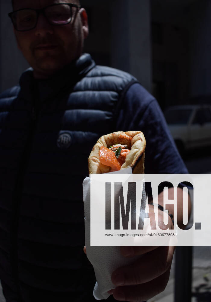 Greece: Popular street food Souvlaki prices soar under inflation A man holds the traditional street food Souvlaki he has just bought from a restaurant. The price of Greece s most popular street food soar, as inflation has increased to around 10.7 percent in May from 10.2 percent in April, reaching its highest level in 28 years. Athens Greece