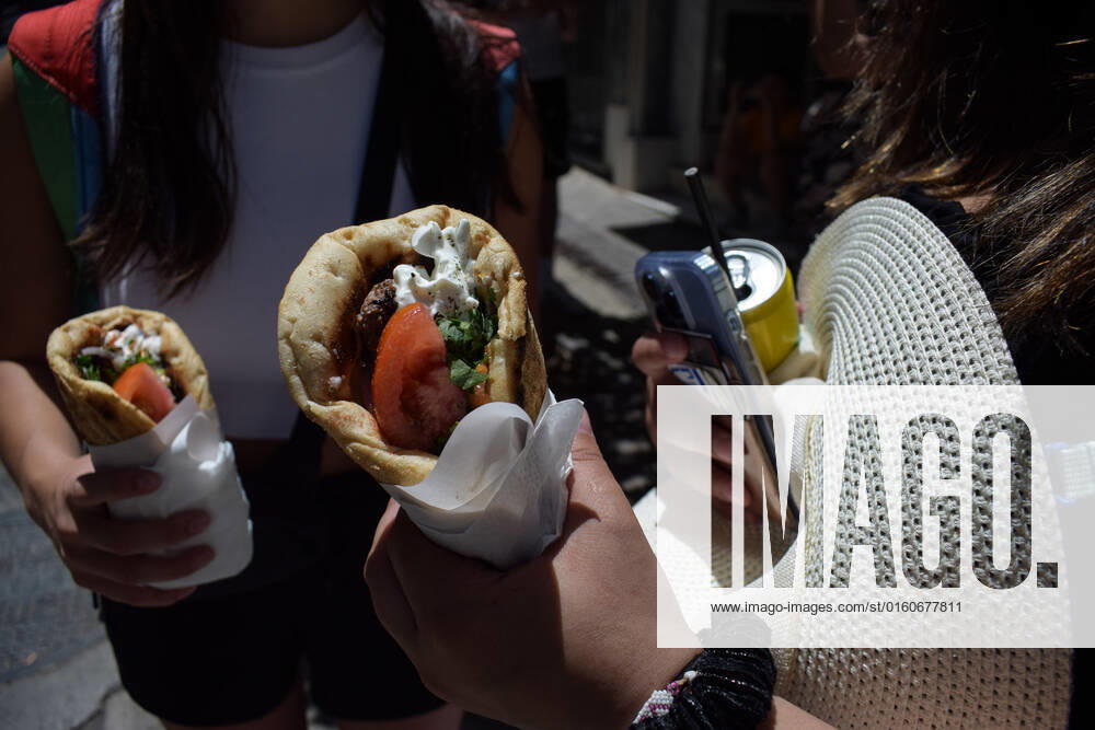 Greece: Popular street food Souvlaki prices soar under inflation Two women hold the traditional street food Souvlaki they have just bought from a restaurant. The price of Greece s most popular street food soar, as inflation has increased to around 10.7 percent in May from 10.2 percent in April, reaching its highest level in 28 years. Athens Greece