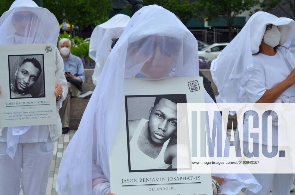 NY: Demonstration Honoring Victims of Massacre Shootings New Yorkers are seen holding photos of deceased individuals in Lower Manhattan, New York City to honor the victims of Shooting victims on June 12, 2022. New York New York United States