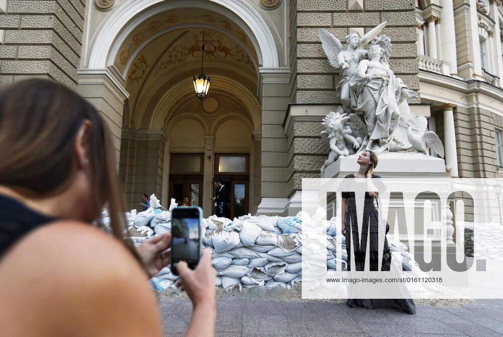 The Odesa Opera Theatre Opened Its Doors To Visitors, For The First Time Since The Russian Invasion In Ukraine A woman poses for a photo next to the Odesa National Academic Opera and Ballet Theatre in Odesa, Ukraine 17 June 2022. The Odesa National Academic Opera and Ballet Theatre opened its doors to visitors again, for the first time since the Russian invasion in Ukraine, and resumes showing their performances and concerts. The first concerts Opera Gala , Ballet Gala and the opera A Zaporozhian Beyond the Danube are dedicated to Ukrainian Army. Odesa Ukraine
