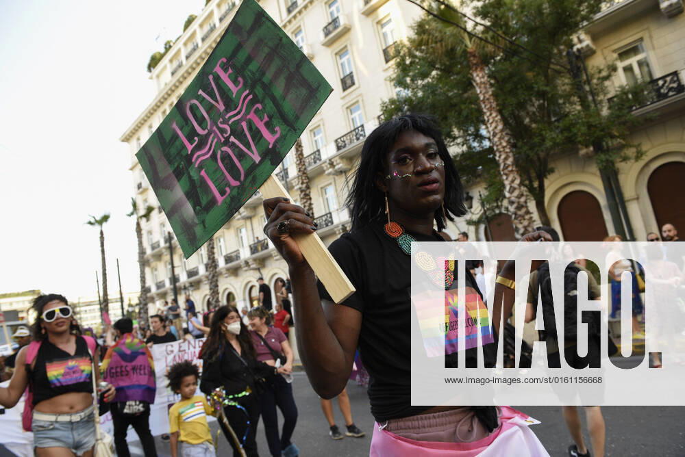 People march waving rainbow flags and holding placards, during the Athens Pride anual parade. Thousands demonstrated during the Athens Pride 2022 parade to raise awareness, elevate the visibility of LGBTQ persons in Greek society and defend their rights against sexual discrimination. Athens Greece - ZUMAg221 20220618_zap_g221_031