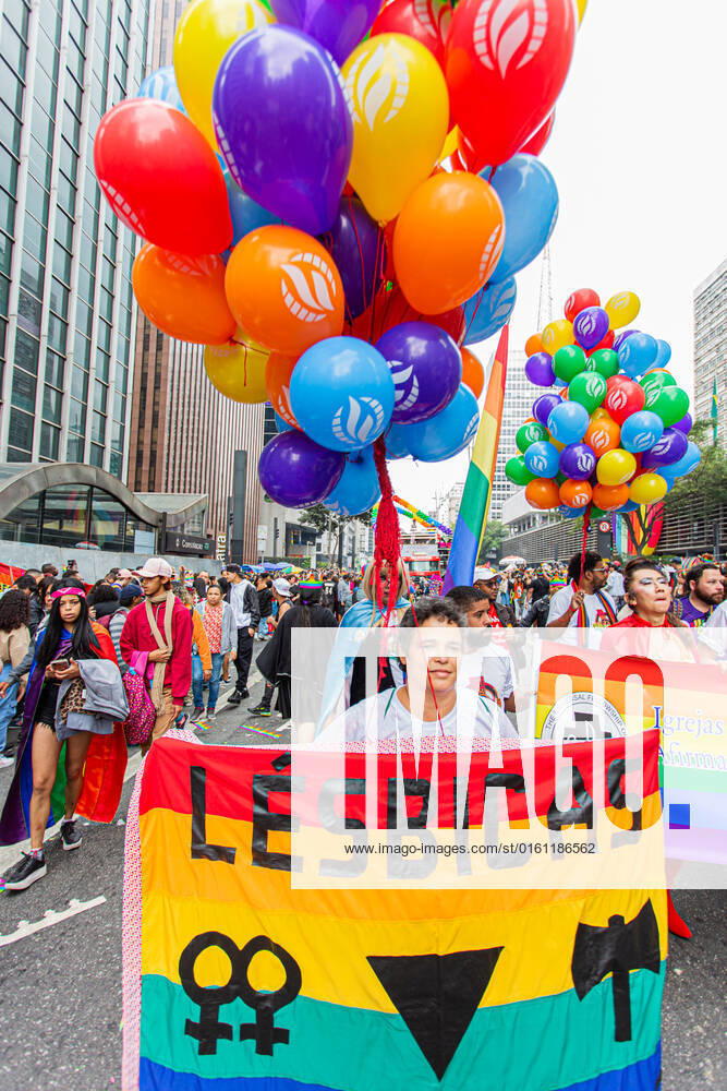 SÃO PAULO, SP - 19.06.2022: PARADA LGBT - 26th São Paulo LGBT+ Pride Parade. Parade of electric trios and parade goers (lesbians, gays, bisexuals, transsexuals, transvestites, queer, intersex and asexuals). Avenida Paulista, São Paulo, June 19, 2022. x2222803x VanxCampos